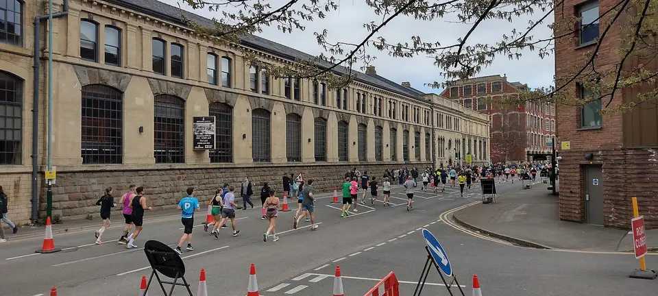 Runners on the Lower Bristol Road during the Bath Half, past the Stothert and Pitt works