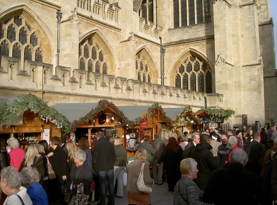 Christmas market chalets beside Bath Abbey