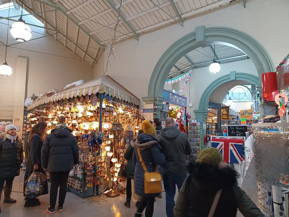 Inside Guildhall Market, Bath, with stalls under a glass roof