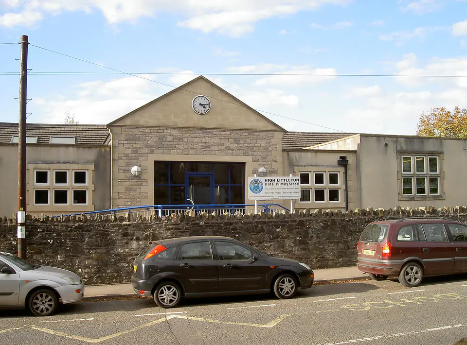 High Littleton primary school and stone wall, Somerset