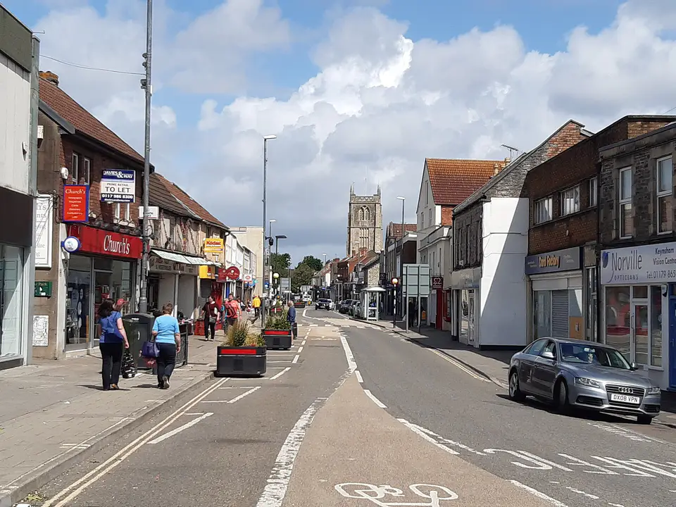 Keynsham High Street, with shops and cycle lane