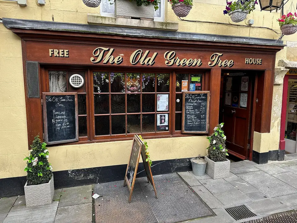 The wood-panelled front of The Old Green Tree pub on Green Street, Bath