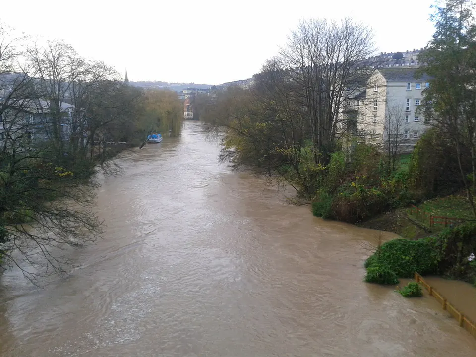 High, brown River Avon at Cleveland Bridge, Bath