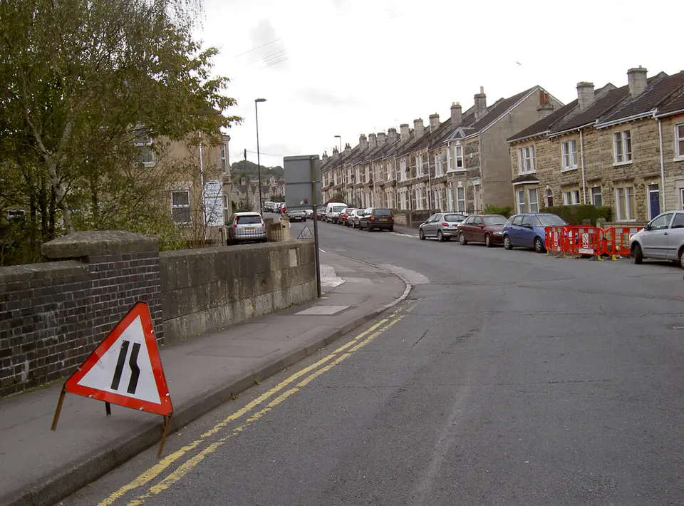 Road narrows sign and cones on Bridge Road, Bath